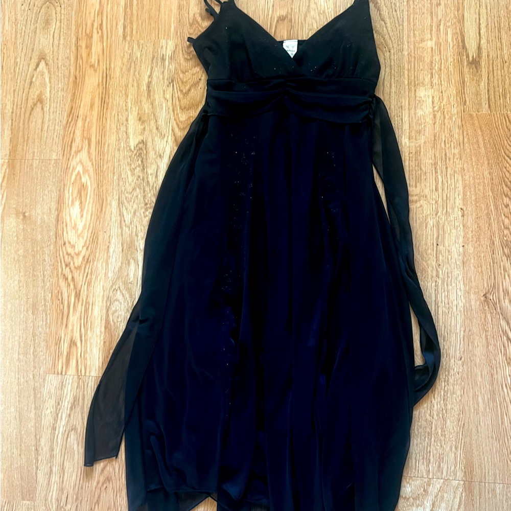Plain black flowy dress, spaghetti straps, waistband ties in back into a bow